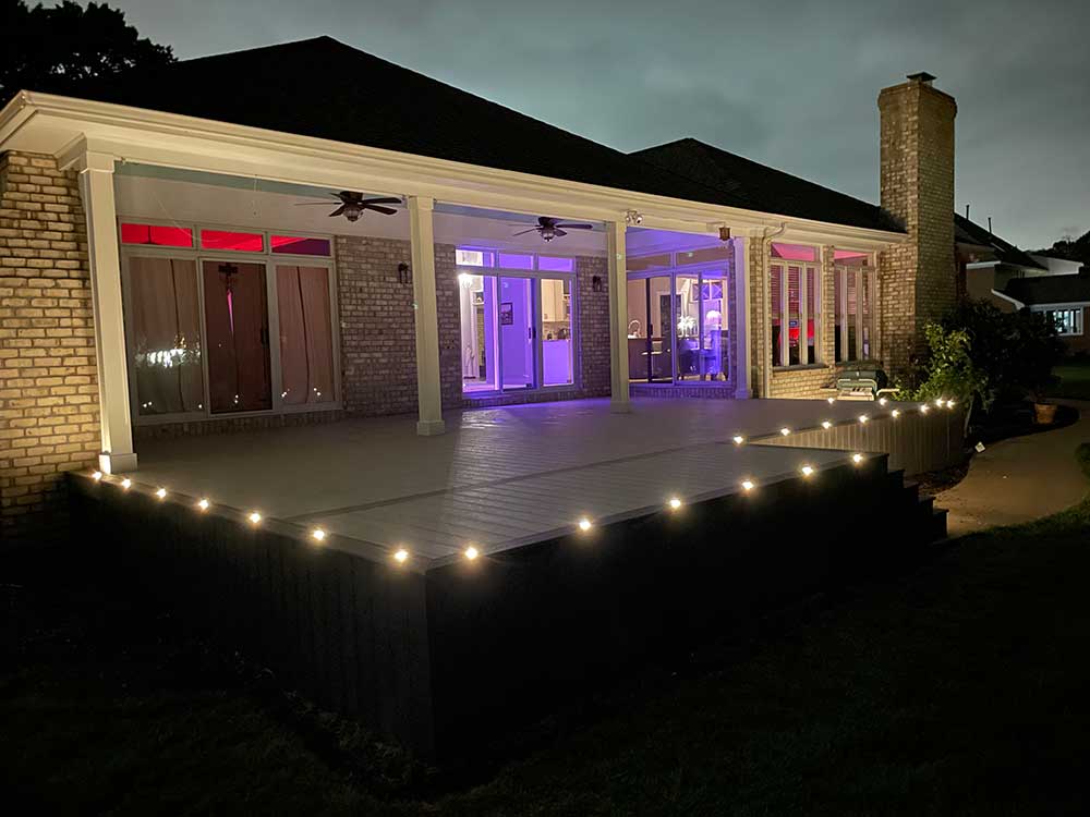 PVC deck with LED lighting, built by First in Decks and Fencing, offering a sleek, modern outdoor space perfect for evening enjoyment.